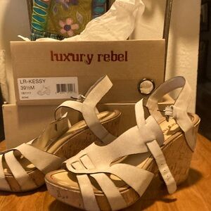 Gently used Luxury rebel platform sandals size 9